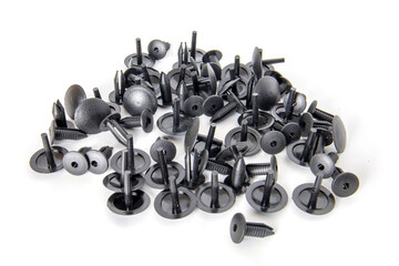Black clips. Car spare parts isolated on white.