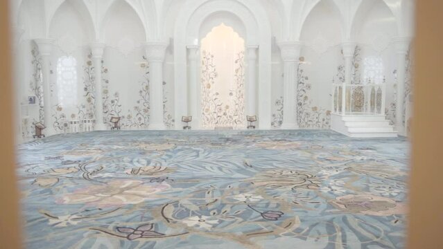 Beautiful interior of white mosque with patterns. Scene. Light white mosque with floral patterns inside. Fabulous bright interior of white mosque
