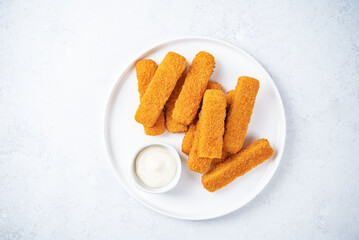 Fresh prepared fish sticks with sauce