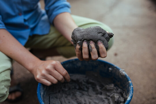 Woman doing pottery outdoors