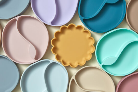 Kid plate in shape of sun with other colored ones