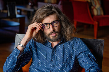 Young professional man at work wearing glasses