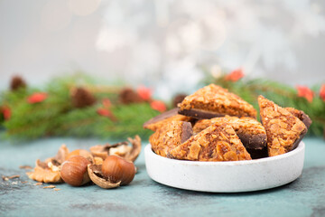Nut corner triangles, traditional german sweets called Nussecke, covered with chocolate, christmas cake 
