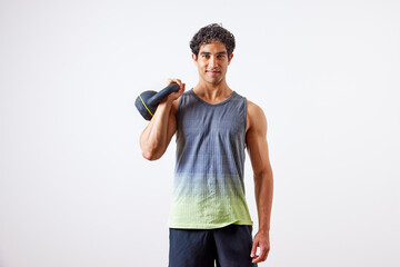 Self-assured sportsman with kettlebell