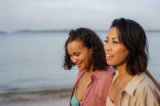 Two Women Hanging Out At Beach Together