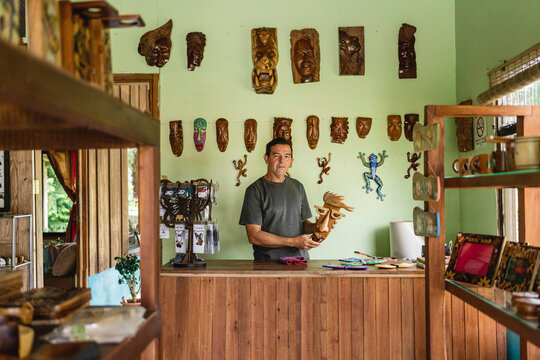 Man in his handicraft store. 