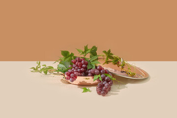 Copper pan with fresh red grapes.