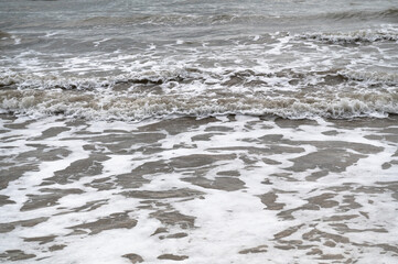 waves on the sand beach in Italy