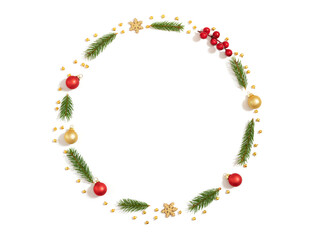 Christmas wreath isolated on a white background. New Year frame with fir branches, baubles and snowflakes. View from above. Space for text.