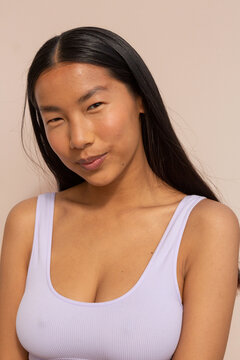 Confident woman with white bra portrait