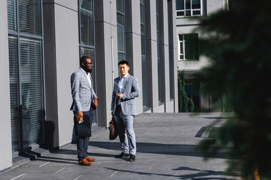 Businessmen waiting on street 