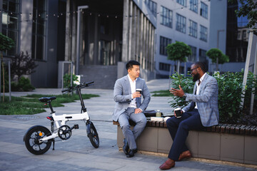Coworkers chatting over snack pause 