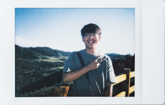 Polaroid photo of young man in nature