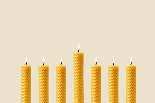 Natural Yellow Beeswax Candles In A Row.