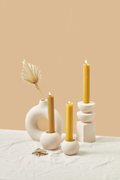 Composition of candles in stylish holders.