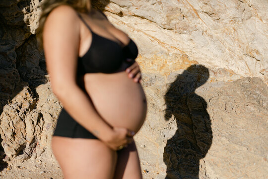 A Shadow Shilouette of a Pregnant Woman