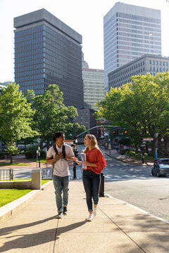 Two cute Friends University Students and Providence Skyline
