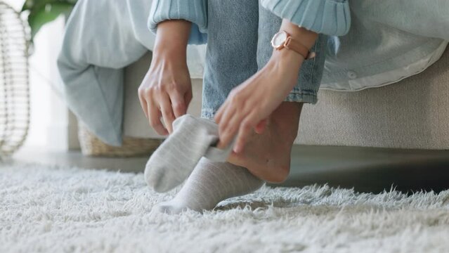 Woman, hands or feet in winter socks in house, home bedroom or hotel interior. Zoom, wardrobe clothes or fashion apparel for fun, playful or relax model barefoot on luxury floor carpet or texture rug