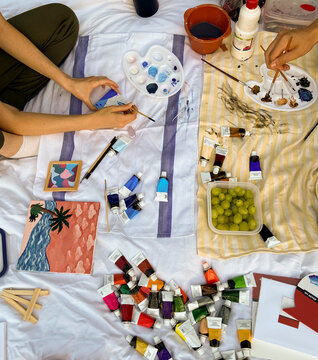 Two teens creating a project together