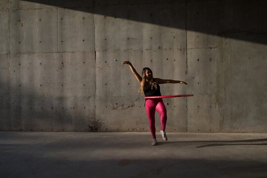 woman does her hula hoop workout