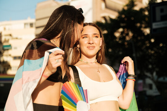 Lesbian couple walking on pride parade
