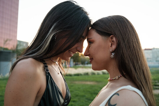 Smiling lesbian couple face to face