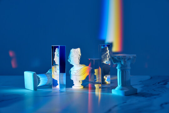 Antique bust and triangular prisms with rainbow.