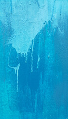 Blue painted wall texture with stains and smudges
