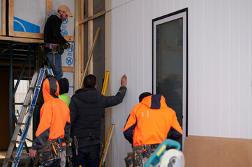 Apprentice builders on site at construction site