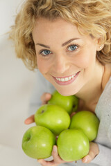 happy woman holding green apple