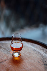 Glencairn glass on whiskey barrel