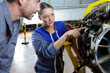 two engineers fixing an engine © auremar