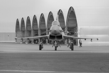 Black and white photo of head on view of Typhoon 938 taxiing at RAF Coningsby - stock photo - obrazy, fototapety, plakaty