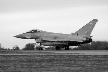 Black and white Photo of Typhoon 438 approaching V1 at RAF Coningsby - stock photo - obrazy, fototapety, plakaty