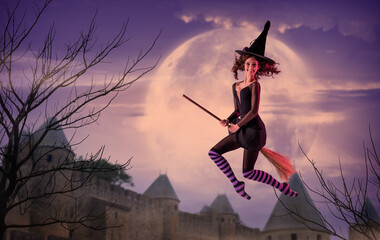A ballerina on pointe shoes in a black witch costume with a hat flies on a broom against the...