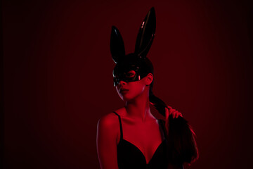 Photo of charming stunning lady wearing rabbit costume looking tempting isolated on dark maroon...