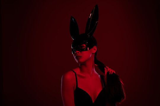 Photo of charming stunning lady wearing rabbit costume looking tempting isolated on dark maroon color background