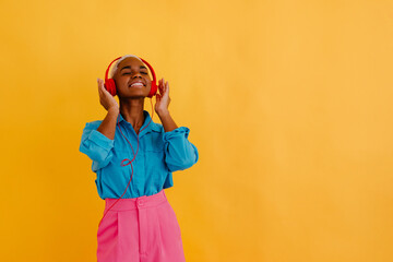 Smiling black woman listening to song in headset