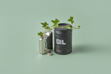 Steel canister with growing plant and oil barrel.