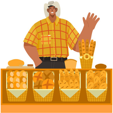 Local business owner working as cashier clerk at his bread bakery store at checkout counter desk. Showcase full products. Retail business. Happy smiling man in cowbow hat friendly waving his hand