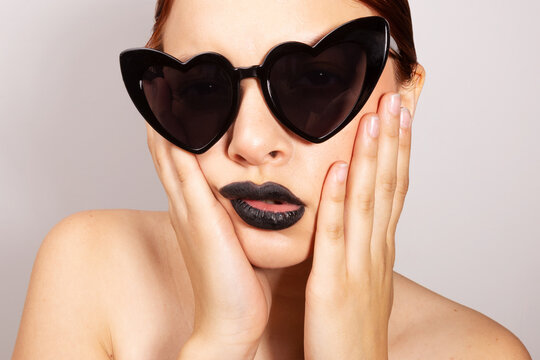 Beautiful woman wearing stylish sunglasses