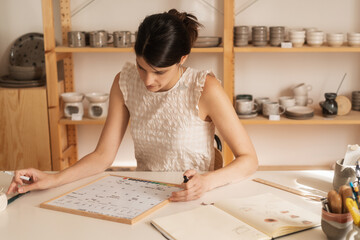 Female Entrepreneur Making A Weekly Plan