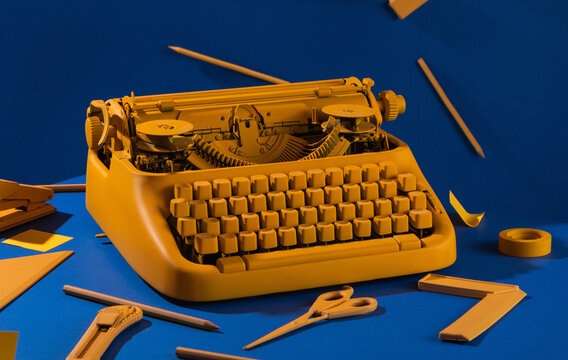 office utensil with typewriter on blue