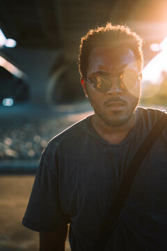 A Dancer Poses Beneath A Bridge In The City