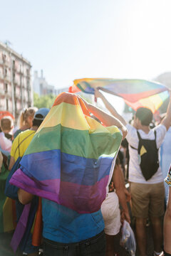 Man covered in the pride flag