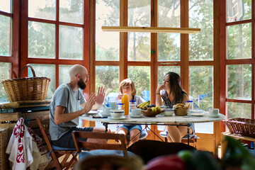 parents and son during breakfast