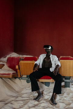 Black man in VR goggles exploring cyberspace 
