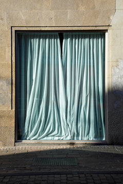 A showcase with curtains.