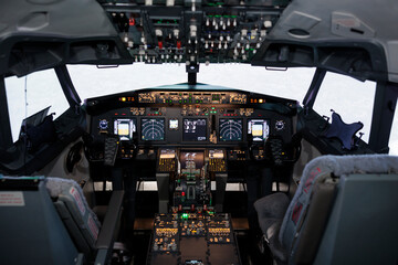 No people in empty plane cockpit with electronic dashboard control, engine throttle to fly...