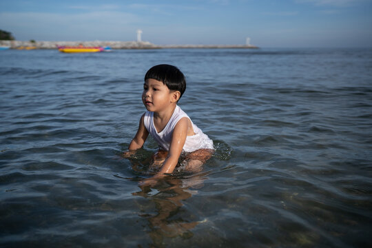 Boy soaking in sea water